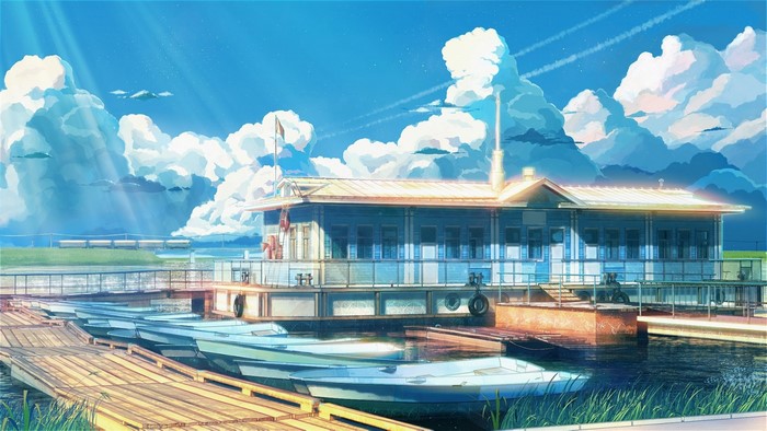 Boats docked at a pier with a building and clouds