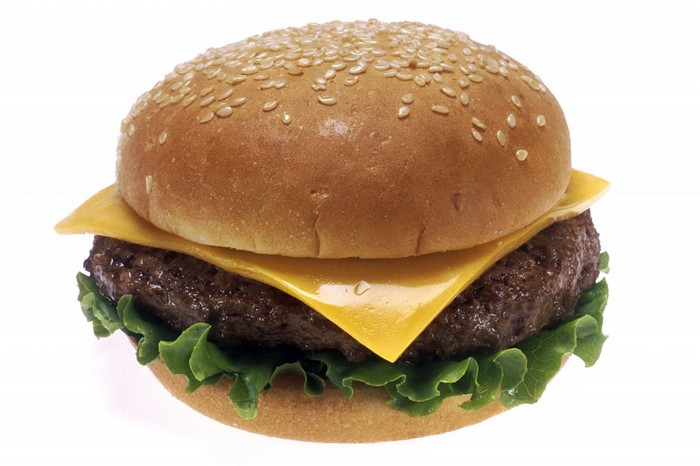 Cheeseburger with lettuce and sesame seed bun
