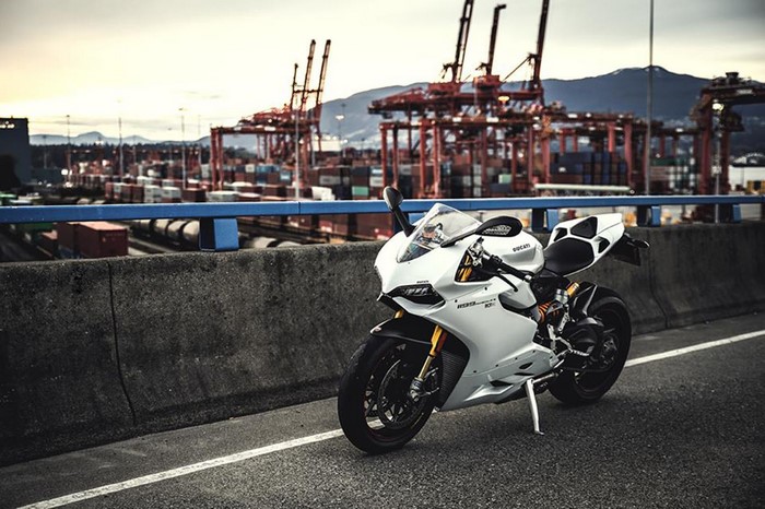 White Ducati 1199 Motorcycle at Port with Cranes
