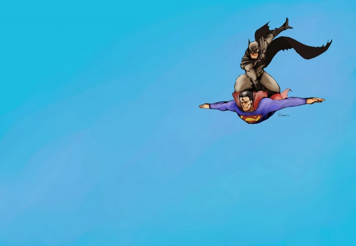 Batman riding on Superman flying in the sky