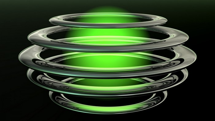 Abstract metallic rings with green glowing light