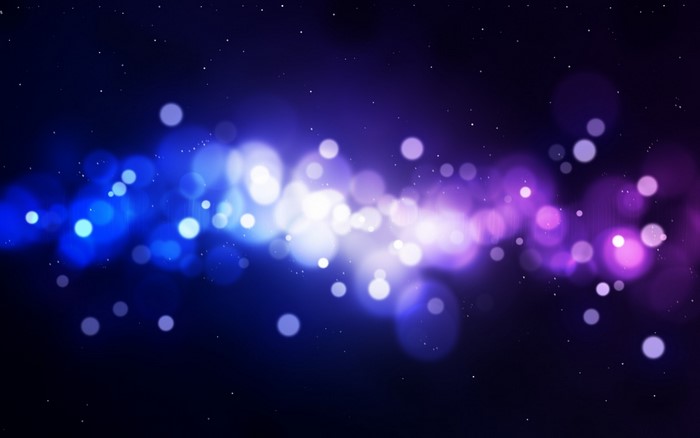Abstract bokeh lights in blue and purple with stars