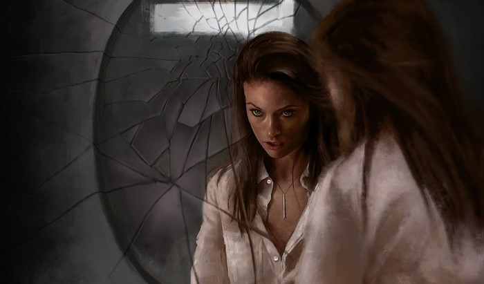 Olivia Wilde looking into a cracked mirror