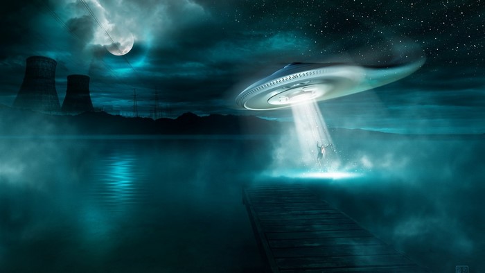 UFO abduction over a lake near cooling towers at night