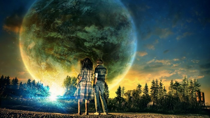 Two people looking at a giant planet in the sky