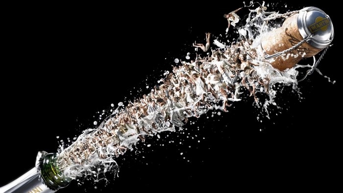 Champagne cork popping with people
