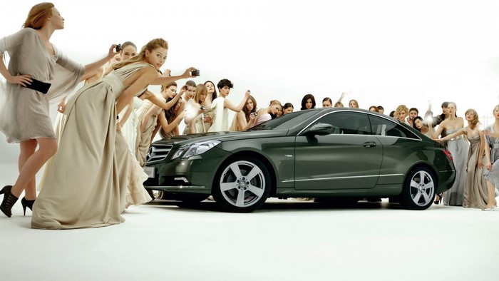 Mercedes-Benz E-Class Coupe with women posing