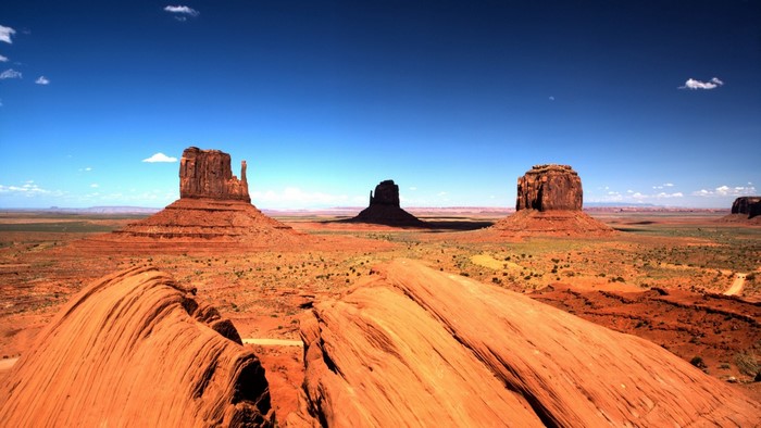 Monument Valley landscape with buttes under a blue sky