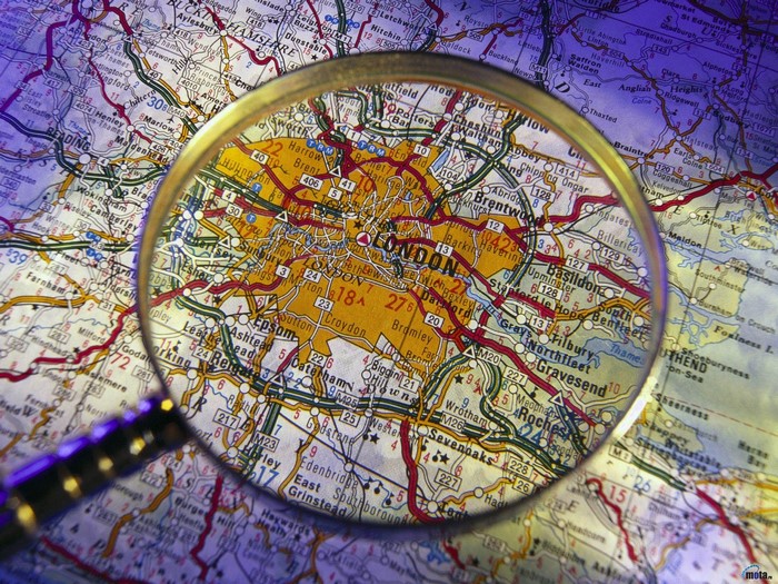 Magnifying glass over a map of London, UK