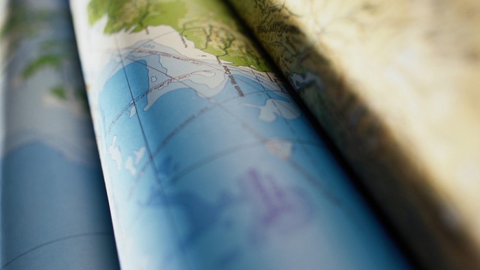 Close up of a world map with blue oceans and green land
