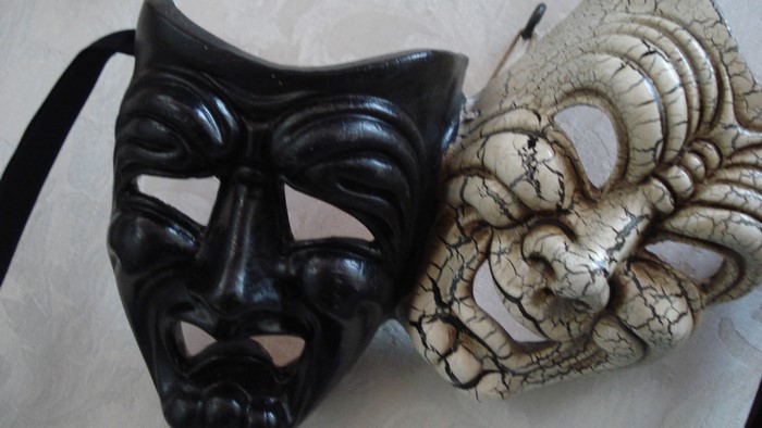Two theatrical masks, comedy and tragedy