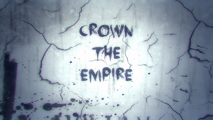 Crown The Empire text on cracked wall
