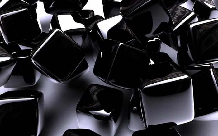Abstract black cubes on a reflective surface