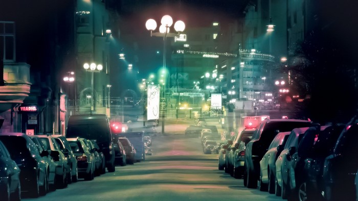 City street at night with cars and lights