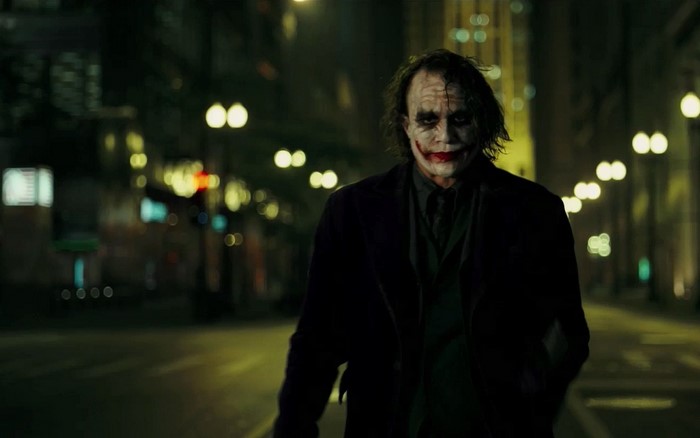 Joker from The Dark Knight walking at night