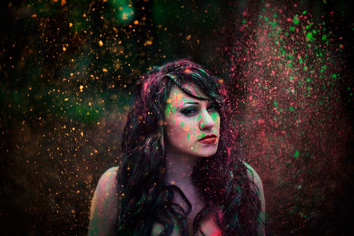 Woman covered in colorful powder