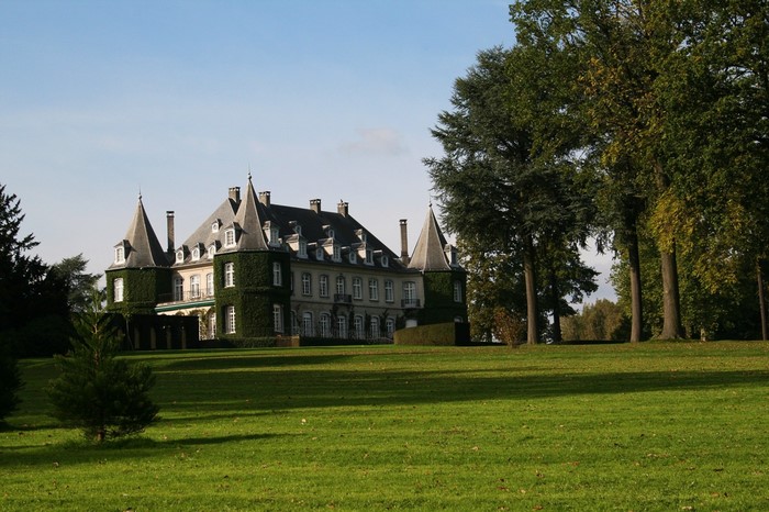 Chateau with manicured lawns and trees