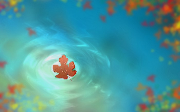 Orange leaf floating in swirling blue water