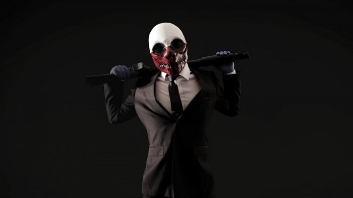 Man in Payday mask holding a rifle