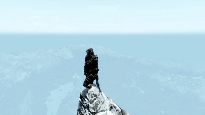 Figure on a snowy mountain peak in The Elder Scrolls V Skyrim