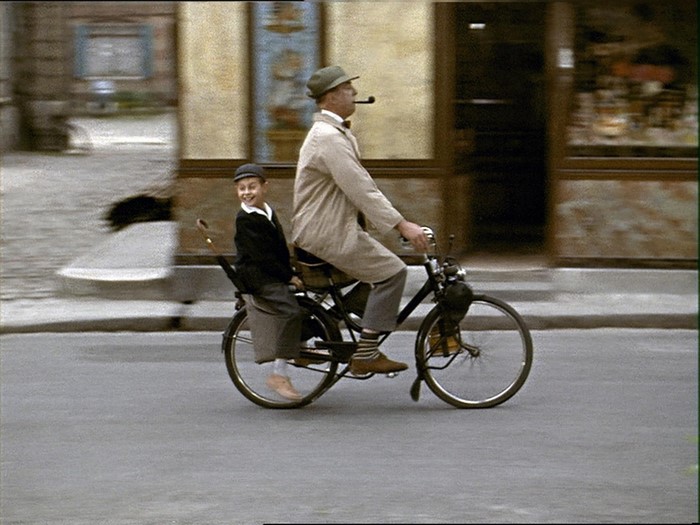 Monsieur Hulot and boy on a moped in Mon Oncle