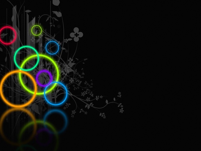 Neon circles on black background with floral design