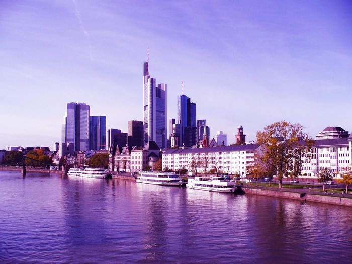 Frankfurt skyline with river and boats