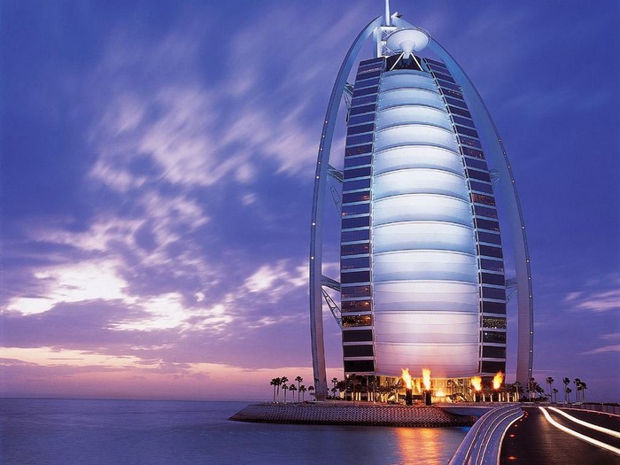 Burj Al Arab hotel at night with ocean view