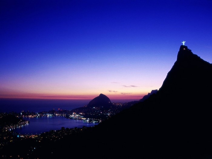 Christ the Redeemer statue overlooking Rio de Janeiro at dusk