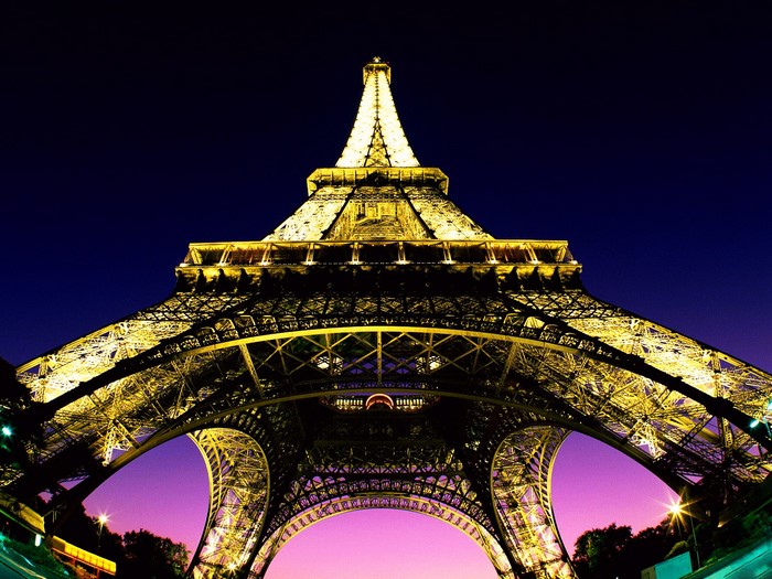 The Eiffel Tower illuminated at night in Paris, France