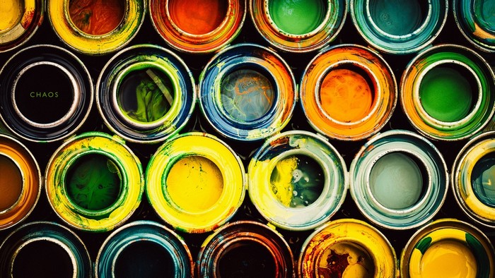 Colorful paint cans arranged in a grid