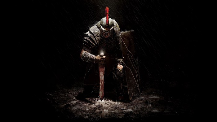 Roman soldier kneeling in the rain with a sword