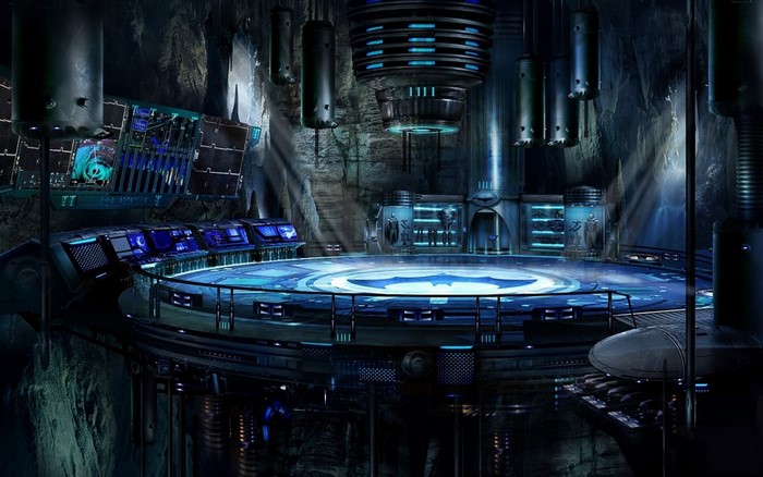The Batcave with computer consoles and Bat-symbol