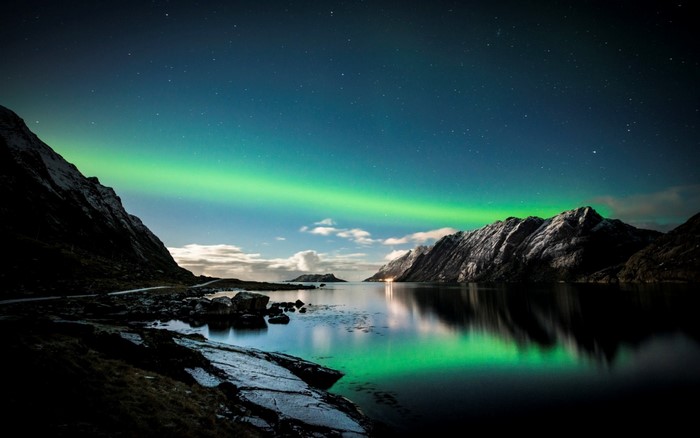 Aurora Borealis over a Norwegian Fjord at Night