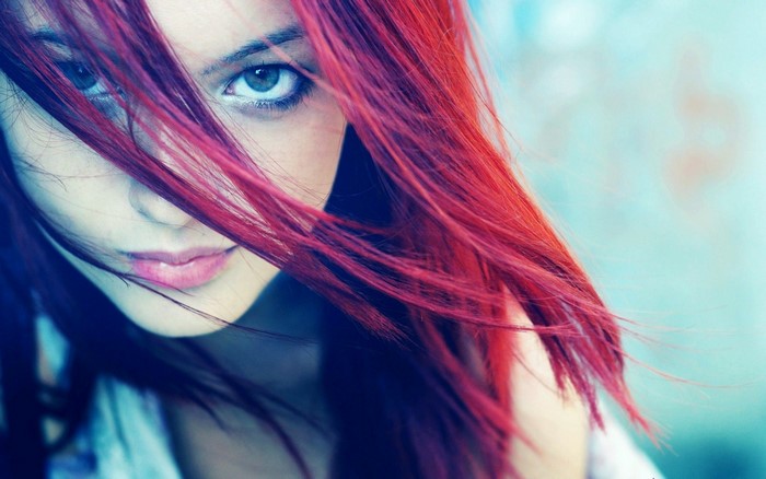 Close up portrait of a young woman with red hair