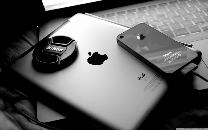 Nikon lens cap on iPad with iPhone and MacBook