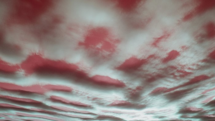 Red and teal clouds in the sky