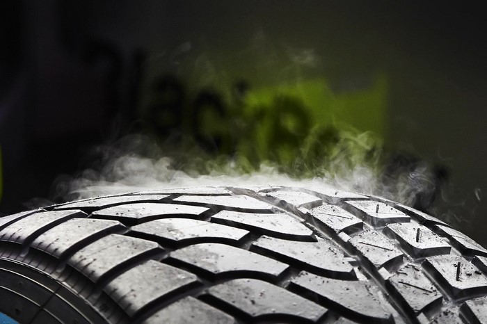 Close up of a smoking racing tire