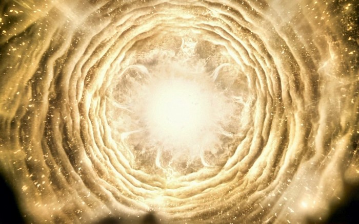 Abstract swirling golden light and cosmic dust