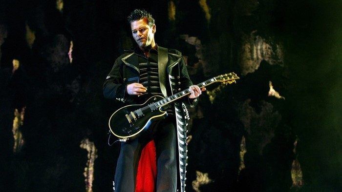 Richard Kruspe playing guitar on stage