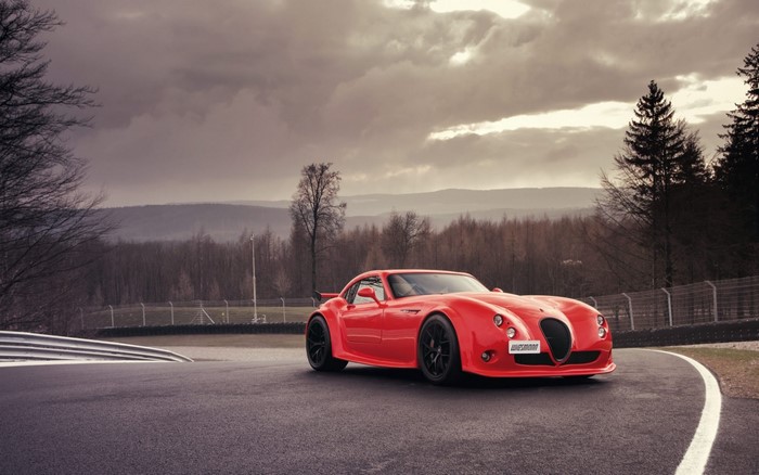 Red Wiesmann MF5 sports car on a race track