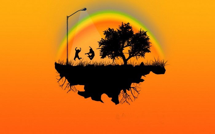 Silhouette of people jumping on a floating island with a tree and rainbow