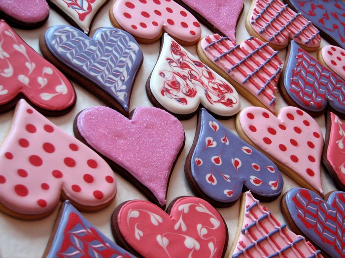 Heart-shaped cookies with various icing designs