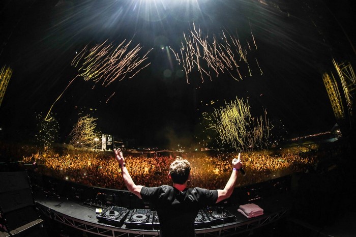 DJ Hardwell performing with fireworks at night