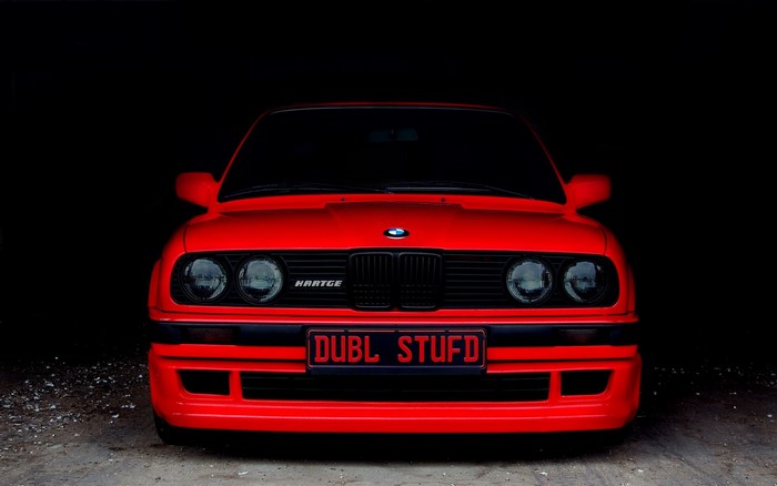 Red BMW E30 Hartge with custom license plate