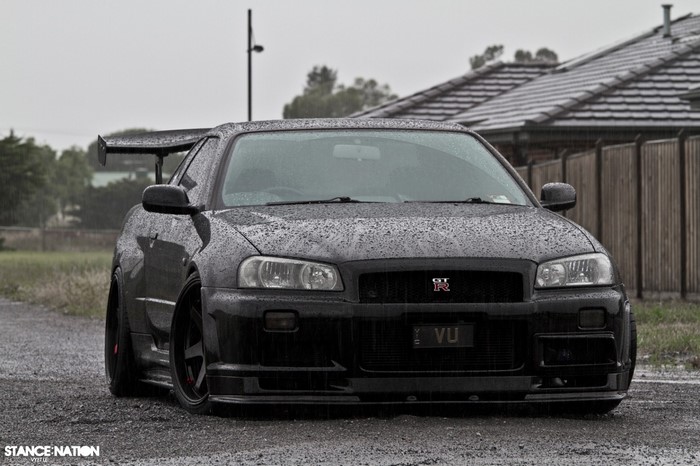 Black Nissan Skyline GT-R R34 with large rear wing