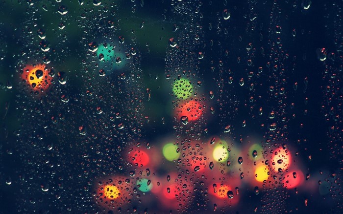 Raindrops on Glass with City Lights Bokeh