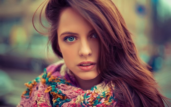 Portrait of a young woman with blue eyes and brown hair