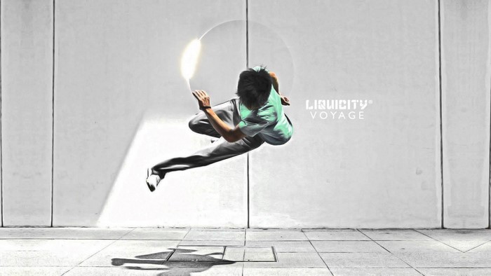 Parkour performer in mid-air with Liquicity logo