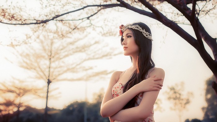 Elegant Woman in Floral Dress at Sunset